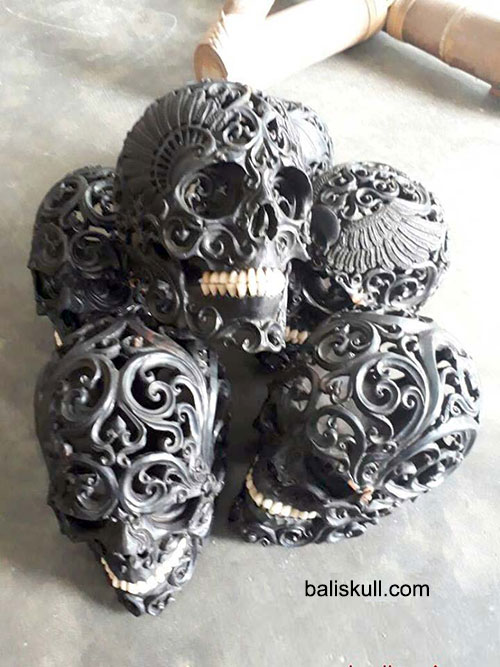 skull made of black wood mixed with bones by Bali Skull