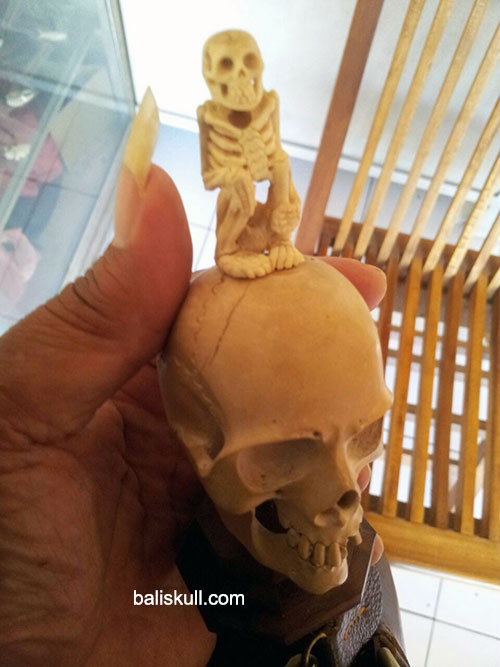 skull and skeleton made of wood mixed with bones by Bali Skull